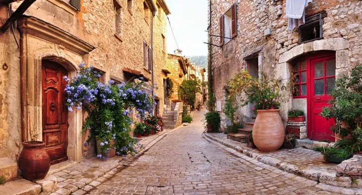 Old French village houses and cobblestone street in Nice