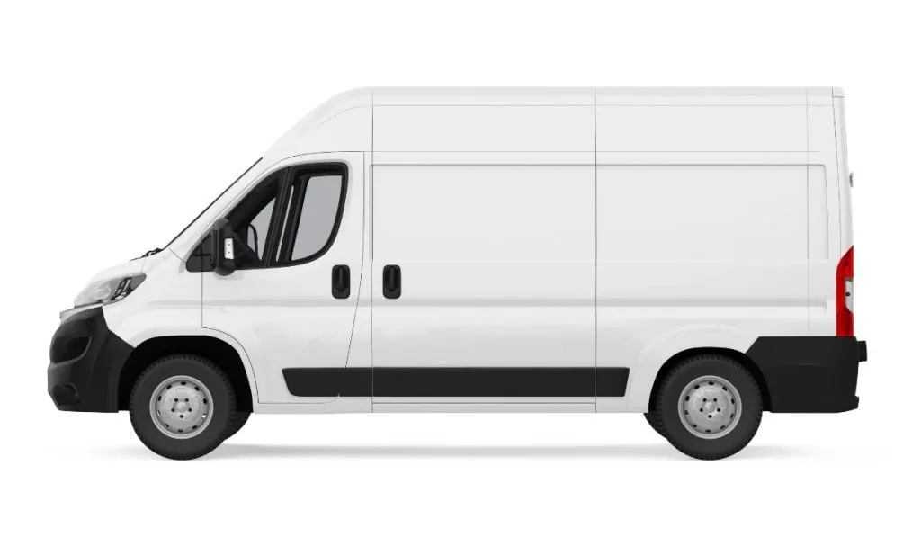 A white high-roof panel van of the kind converted into a single-berth campervan, seen side-on against a plain background